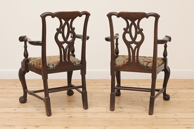 Lot 396 - A pair of Irish mahogany open armchairs
