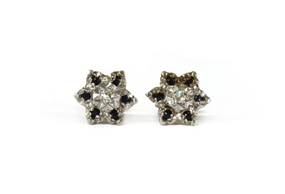 Lot 107 - A pair of 9ct gold diamond and sapphire cluster earrings