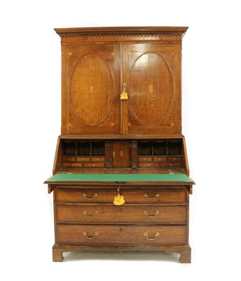 Lot 482 - A George III oak and crossbanded bureau bookcase
