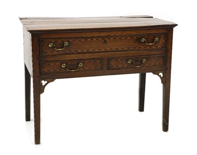 Lot 471 - A George III oak and chequer banded lowboy