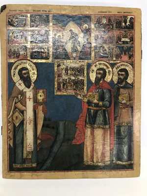 Lot 27 - A large icon of three saints venerating icons
