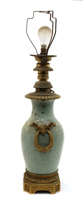 Lot 143 - A Chinese moulded celadon vase