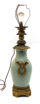 Lot 143 - A Chinese moulded celadon vase