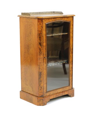 Lot 248 - A Victorian strung walnut music cabinet