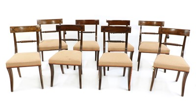 Lot 252 - A set of eight Regency strung mahogany bar back dining chairs