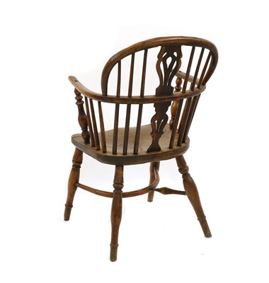 Lot 243 - A yew wood and elm low back Windsor chair