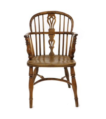 Lot 243 - A yew wood and elm low back Windsor chair