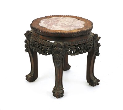 Lot 306 - A Chinese carved hardwood jardiniere stand