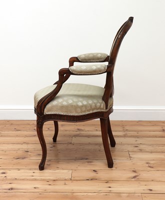 Lot 62 - A carved beech open armchair