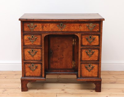 Lot 298 - A George II burr elm and rosewood crossbanded kneehole desk
