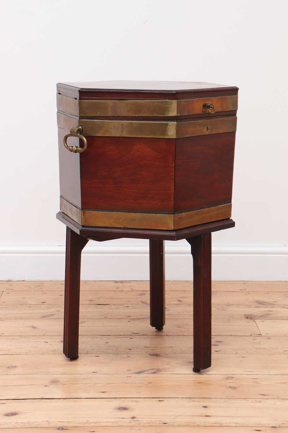 Lot 59 - A George III mahogany brass-bound wine cooler and stand