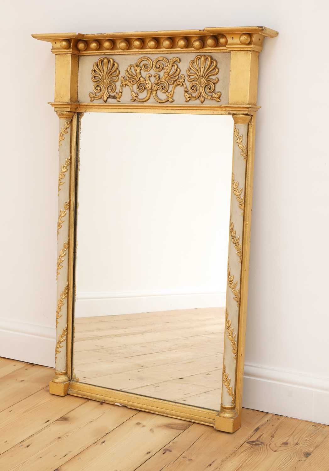 Lot 74 - A Regency-style gilt and painted pier mirror