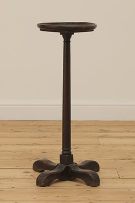 Lot 383 - An oak candle stand