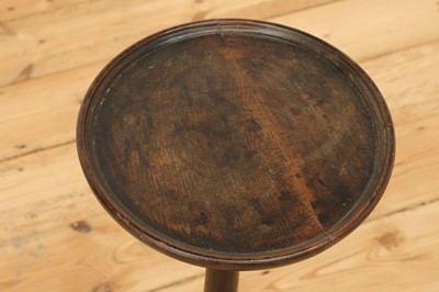 Lot 383 - An oak candle stand