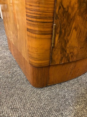 Lot 274 - A pair of Art Deco walnut bedside cabinets
