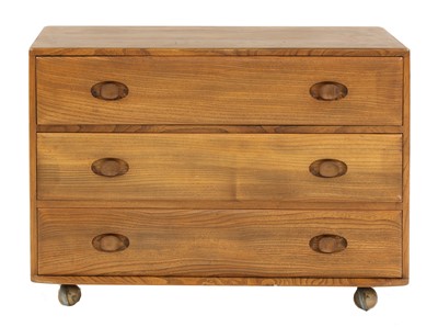 Lot 624 - An Ercol elm chest of drawers