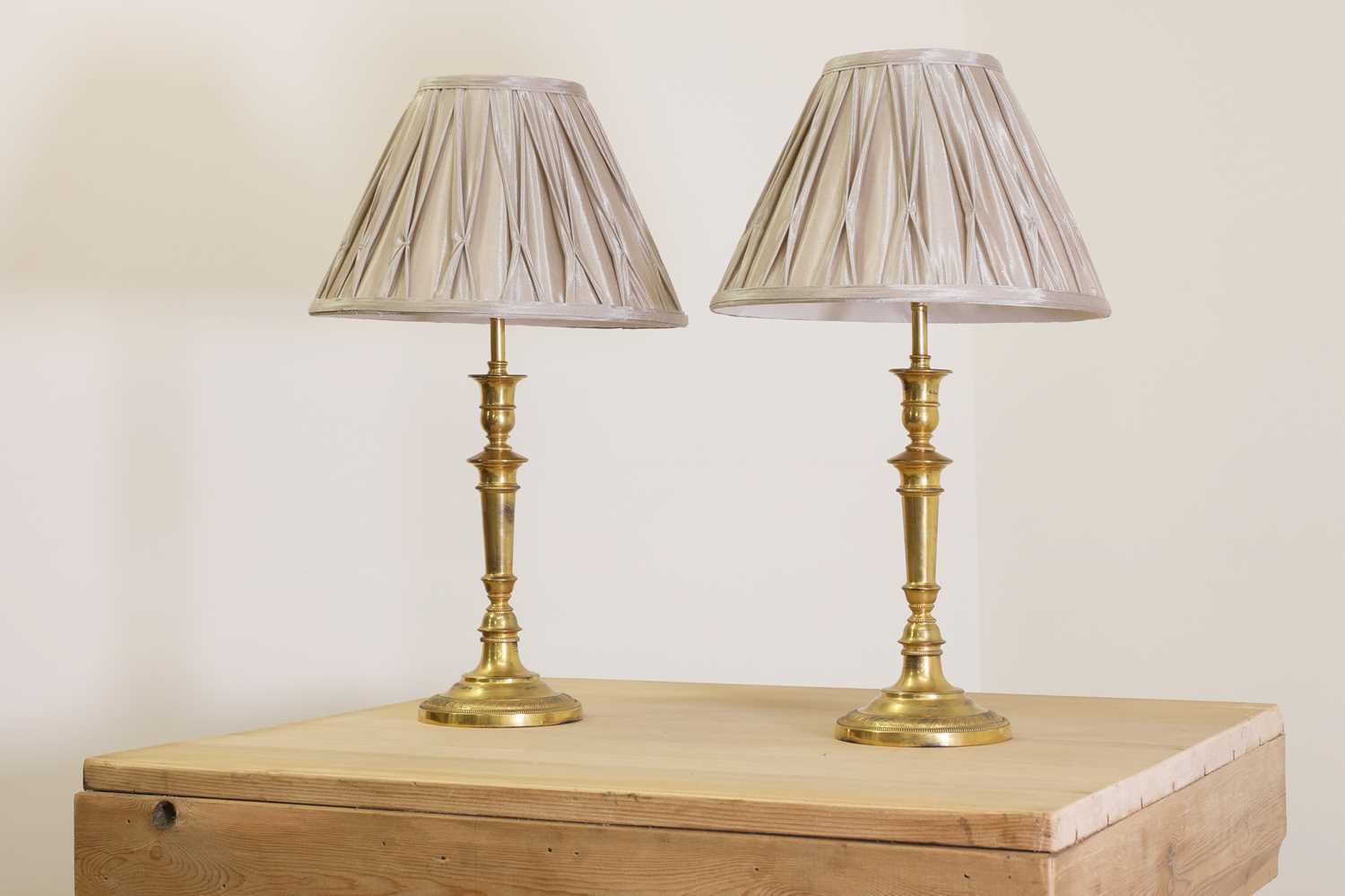 Lot 467 - A pair of gilt-bronze candlestick lamps