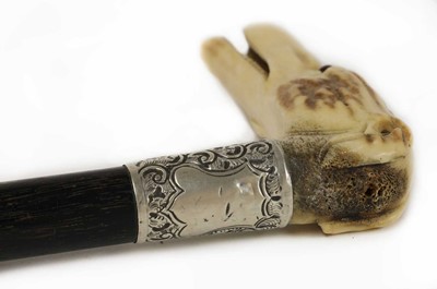 Lot 149 - A late Victorian bone and ebonised rosewood walking stick
