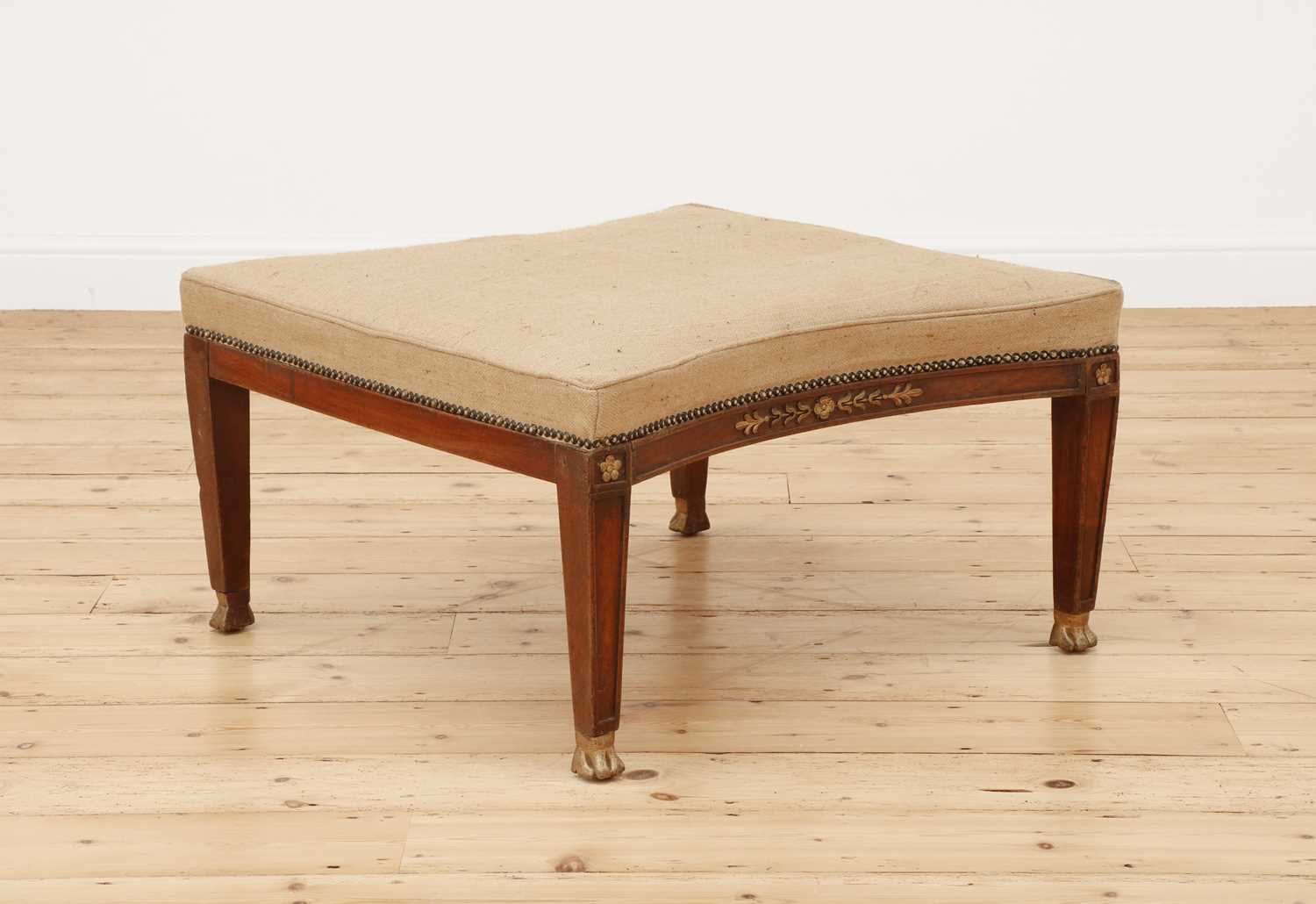 Lot 259 - A French Empire mahogany and parcel-gilt stool