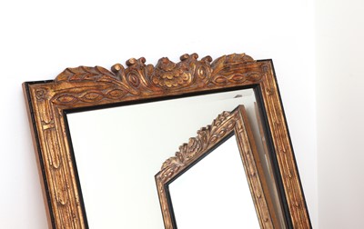 Lot 404 - A pair of ebonised and parcel-gilt mirrors