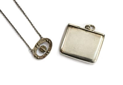 Lot 13 - A sterling silver mother-of-pearl, enamel and marcasite pendant, by Charles Horner