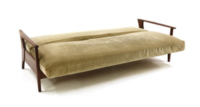 Lot 307 - A teak 'Sunresta' sofa/daybed