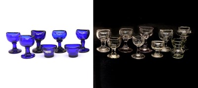 Lot 246 - Collection of clear and cobalt blue glass eye baths