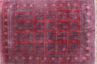 Lot 472 - A red ground Turkoman carpet