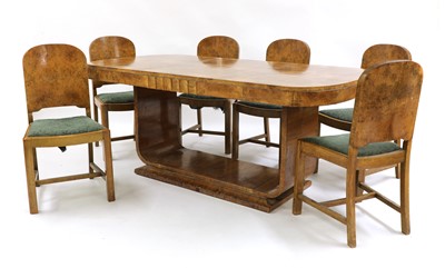 Lot 367 - An Art Deco burr walnut dining suite