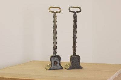 Lot 419 - A pair of cast brass door porters