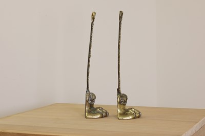 Lot 419 - A pair of cast brass door porters