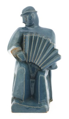 Lot 271 - A terracotta glazed figure
