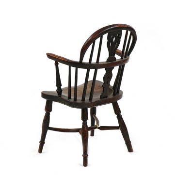 Lot 564 - An elm and yew child's Windsor chair