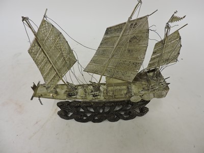 Lot 3 - A Chinese export white metal model of a junk