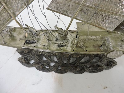Lot 3 - A Chinese export white metal model of a junk
