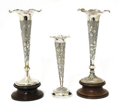 Lot 144 - A pair of Chinese export silver repoussé vases