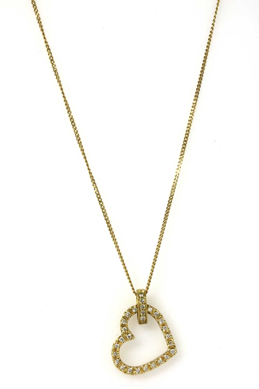 Lot 67 - An 18ct gold diamond heart pendant