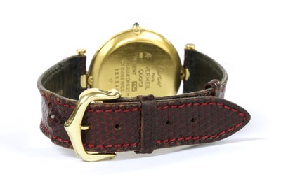 Lot 230 - A vermeil silver gilt Must de Cartier quartz strap watch