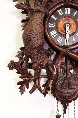 Lot 398 - A large carved Black Forest wall-hanging cuckoo clock