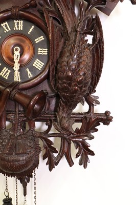 Lot 398 - A large carved Black Forest wall-hanging cuckoo clock