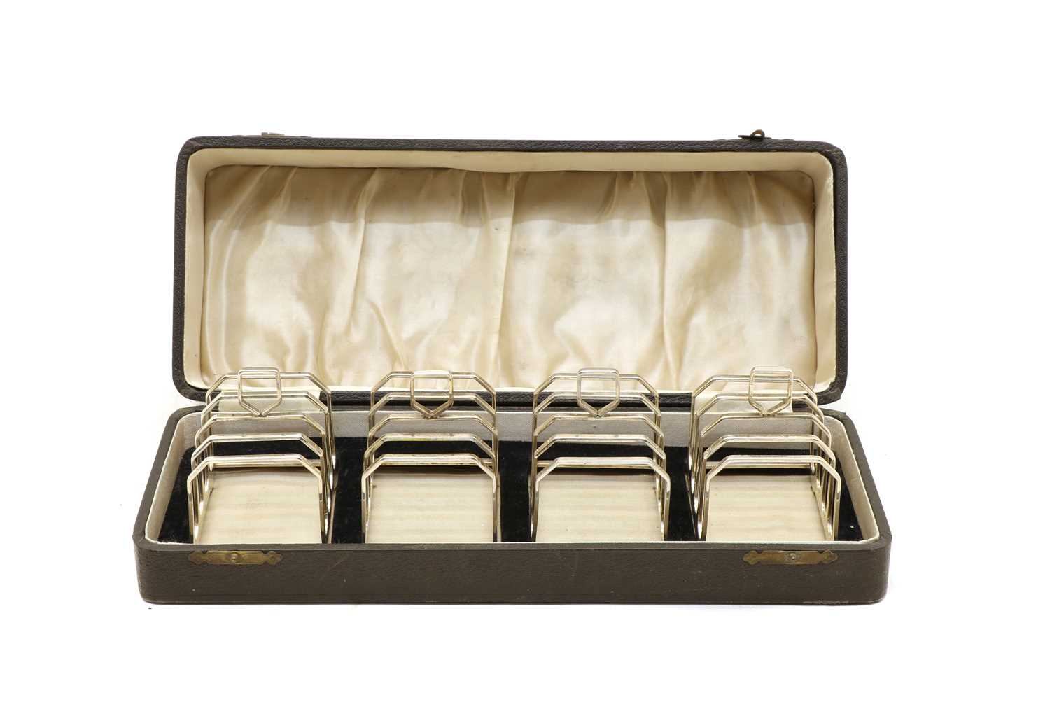Lot 36 - A cased set of four Art Deco silver four division toast racks