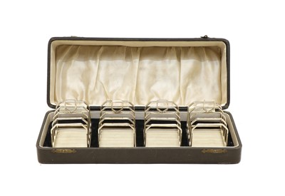 Lot 36A - A cased set of four Art Deco silver four division toast racks