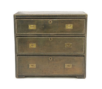 Lot 348 - A leather clad campaign style chest of drawers