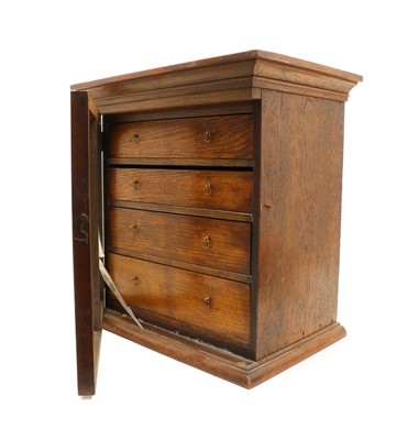 Lot 93 - An early 20th century oak table top collectors cabinet