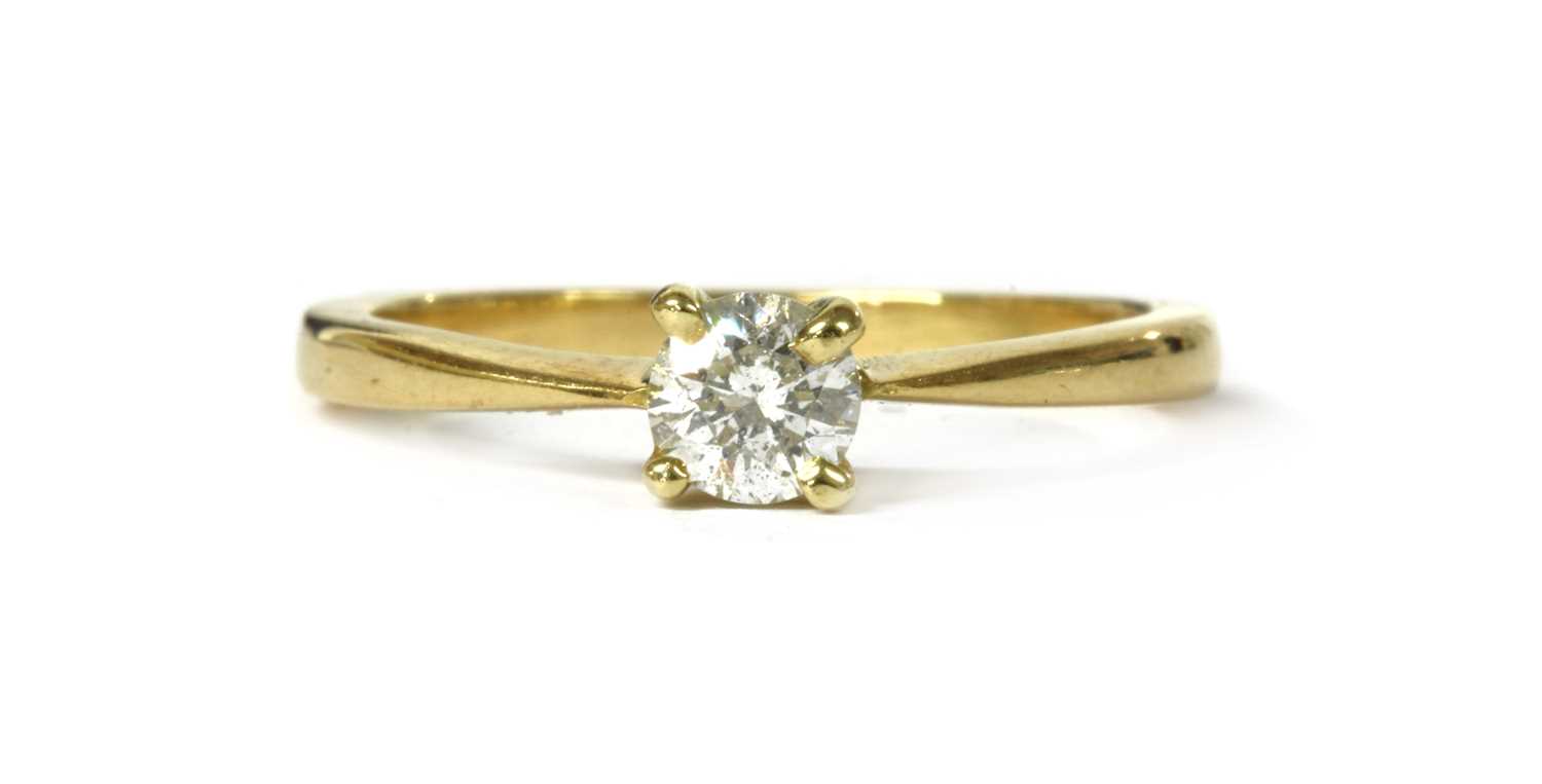 Lot 23 - A gold single stone diamond ring