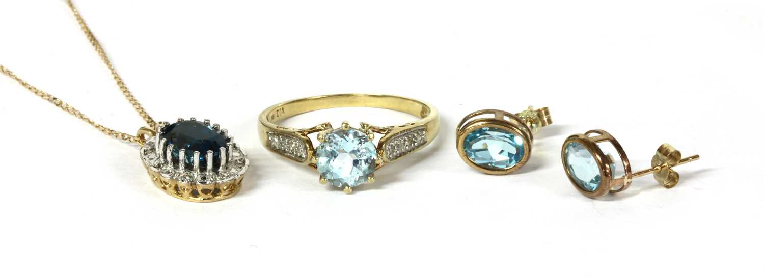 Lot 122 - A 9ct gold blue topaz and diamond ring