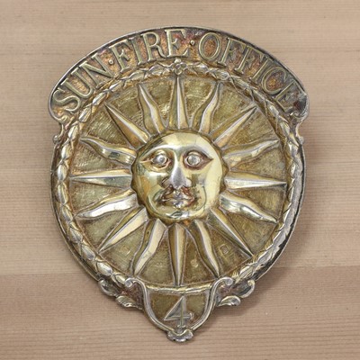 Lot 375 - A George III silver gilt Sun Fire Office fireman's arm badge