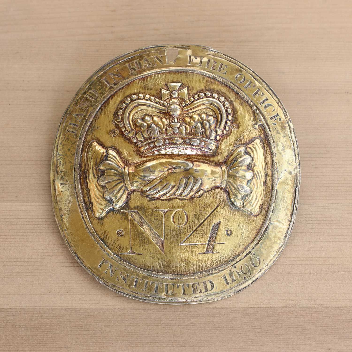 Lot 365 - A silver-gilt fire office fireman's badge
