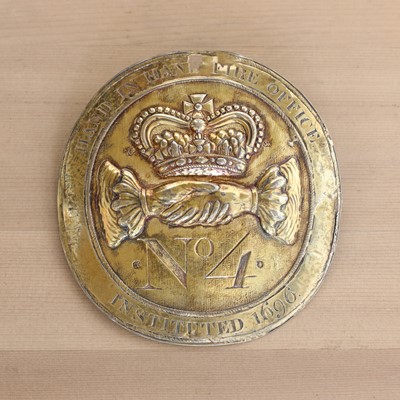 Lot 365 - A silver-gilt fire office fireman's badge
