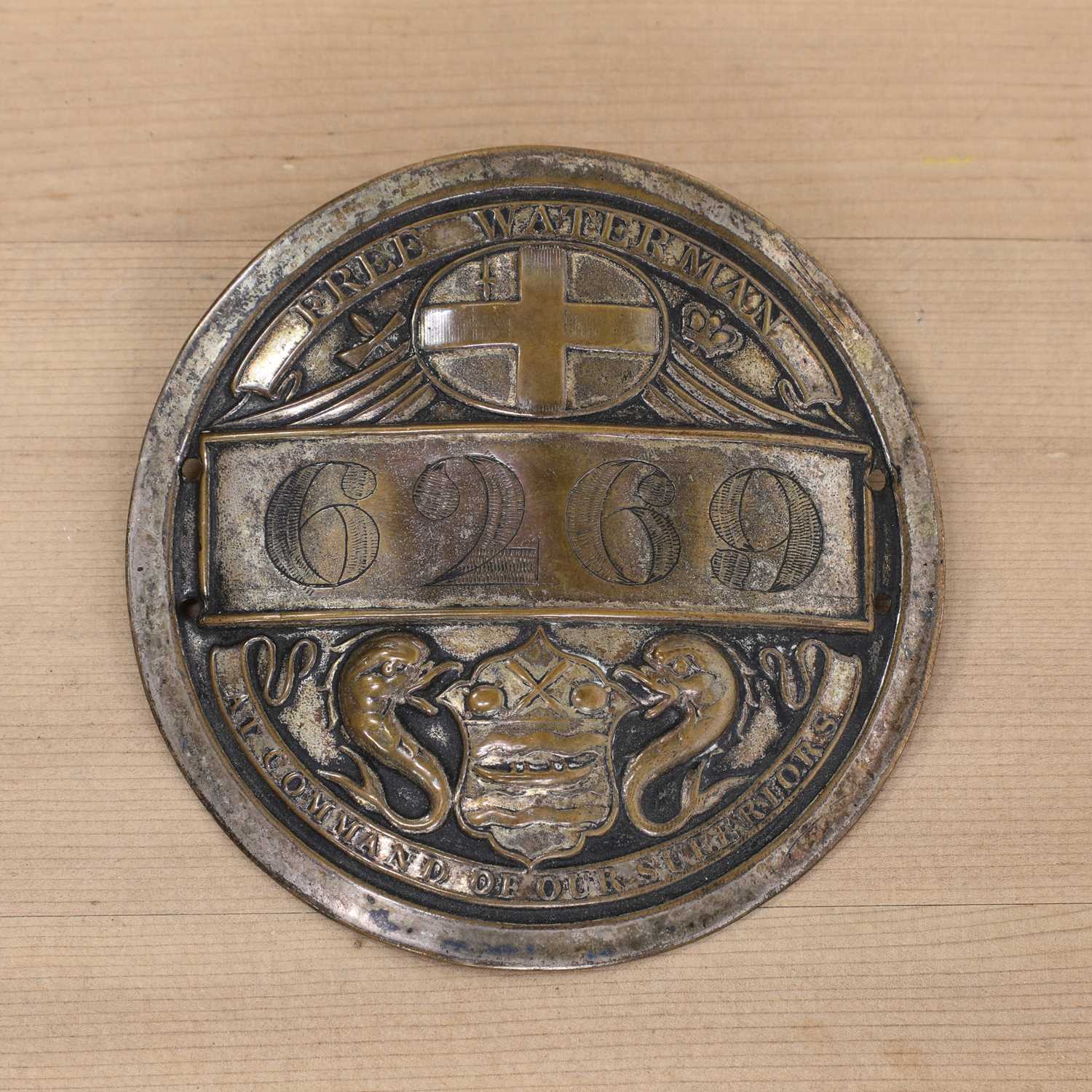 Lot 370 - A silver plate on copper Free Waterman fireman's badge